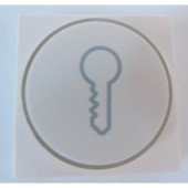 Enjoliveur de finition blanc avec anneau transparent + symbole clé pour bouton-poussoir 6A lumineux NIKO 101-64009